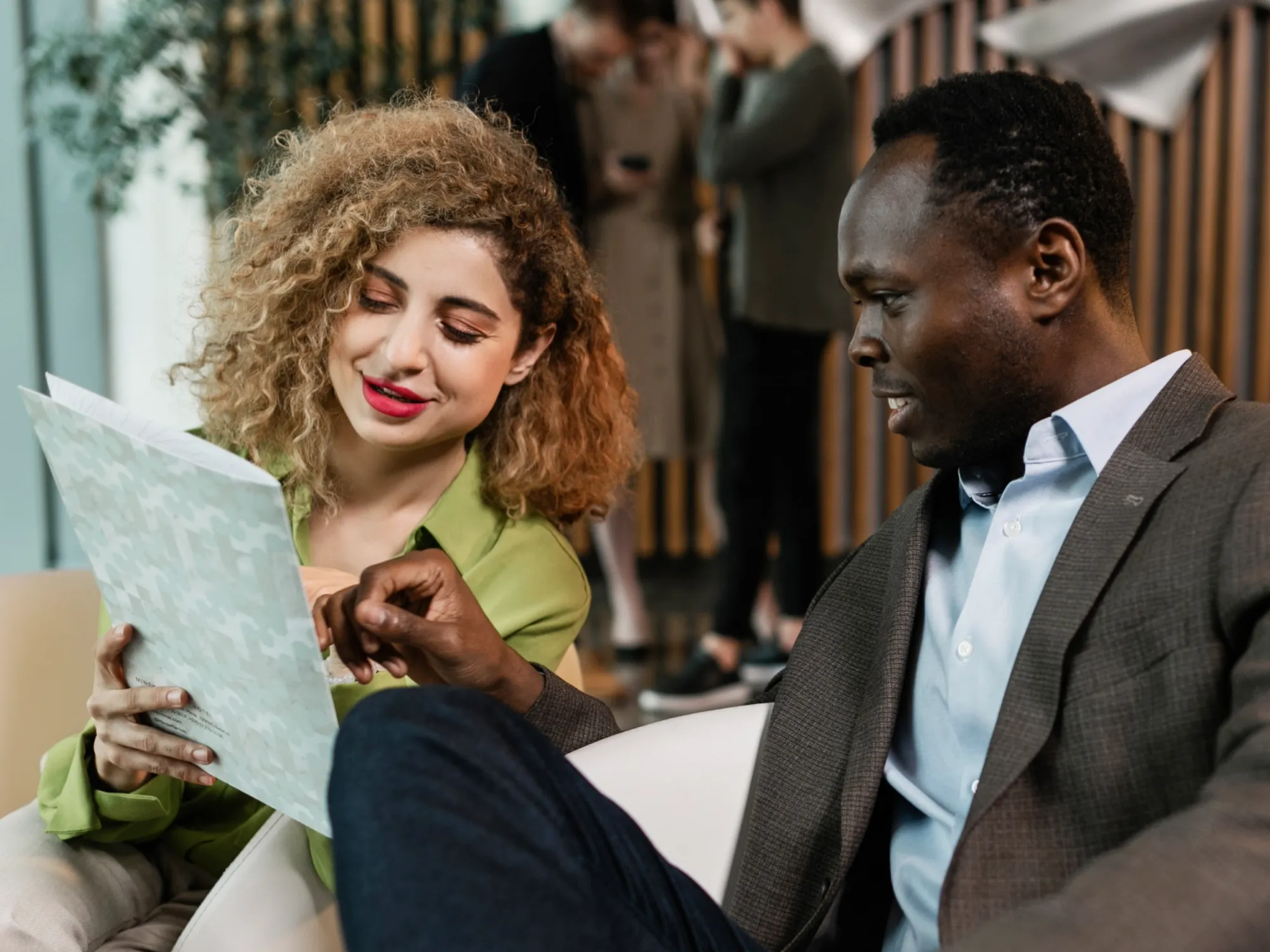Two people reviewing a printed report together